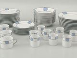 a lot of cups and saucers on the table