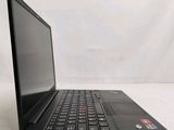the back of a laptop computer sitting on top of a white surface