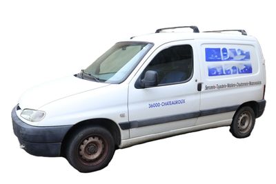 a white van that is parked on the side of the road