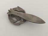 an image of a metal object with a knife on top of it