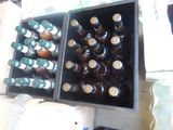many bottles of beer in a box on the table