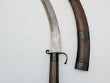 pair of two old and worn knifes on a white surface