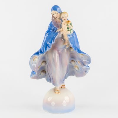 an image of a figurine of a woman holding a baby