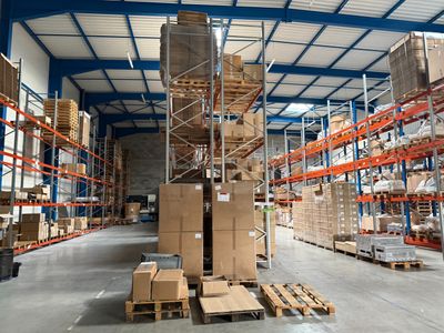 a large warehouse filled with lots of boxes and pallets