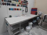 an image of a work area with a table and chairs