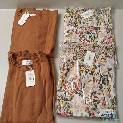 two pieces of clothing sitting on top of a table next to each other
