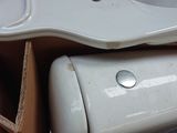 a box with a toilet and a sink in it