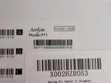 two labels on the back of a laptop computer