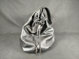 grey leather purse with a knot on the handle