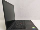 the laptop is open on a white surface with a black keyboard