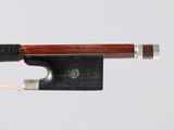 a close up of a violin bow on a white background