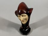 a close up of a figurine of a person wearing a hat