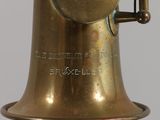 a close up of a brass saxophone with a bell on it