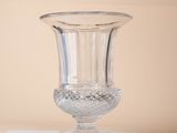 a glass vase sitting on top of a white table