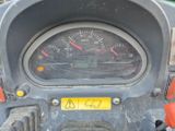 a close up of a motorcycle with a speedometer on it
