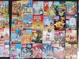a lot of comic books on display on the wall
