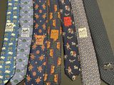 several ties are lined up in a row on a table