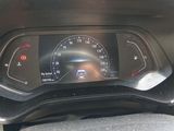 a car dashboard with a speedometer in the center of it