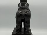 statue of a man with a hat on his head on a black base