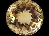 une image représentant un diamant de couleur dorée sur fond noir