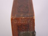 a small wooden box with a metal latch on it