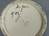 a close up of a white plate with writing on it
