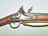 a gun that is on display on a table