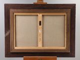 an old wooden easel with a painting on top of it