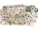 a pile of old postcards on a white surface