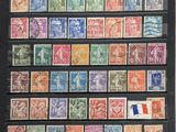 a collection of stamps from different countries on display in a black frame