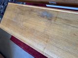 a close up of a wooden bench that has been stained