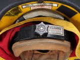 a fireman ' s helmet with a warning label on it