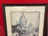 framed picture of a street scene with a church in the background