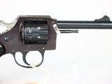 gun on a white background with a white string in the foreground