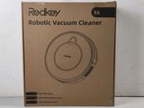 the box of the robot vacuum cleaner is sitting on the table