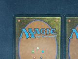 two decks of magic the gathering are on display on a table