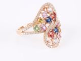 a close up of a ring with multi colored stones on it