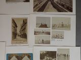 many old photographs of people and buildings on the wall
