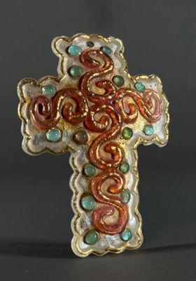 an image of a cross made out of glass beads