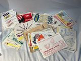 many different types of business cards laid out on a bed