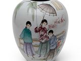 a vase with a picture of a woman and two children on it