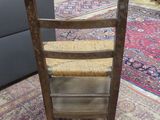 a chair that is sitting on a rug in a room