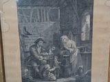 a framed picture of a man and a woman in a kitchen