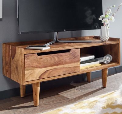 un meuble TV en bois sur lequel est posé un téléviseur à écran plat