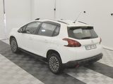 a picture of a white car parked in a garage