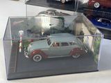 a display case with a variety of model cars in it