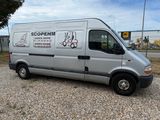 a silver van that is parked in a parking lot