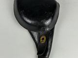 a small black object on a white surface