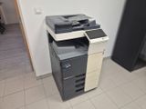 a multi - function printer sitting on the floor in a room