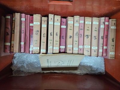 many books on a shelf in a book case
